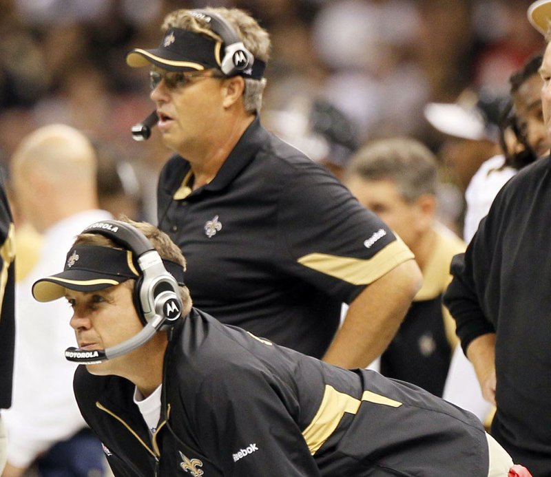 New Orleans Saints Coach Sean Payton (foreground) and former defensive coordinator Gregg Williams were disciplined harshly by the NFL on Wednesday for their roles in the team’s bounty program that targeted opposing players. Payton has been suspended for the 2012 season, and Williams has been suspended indefinitely. 