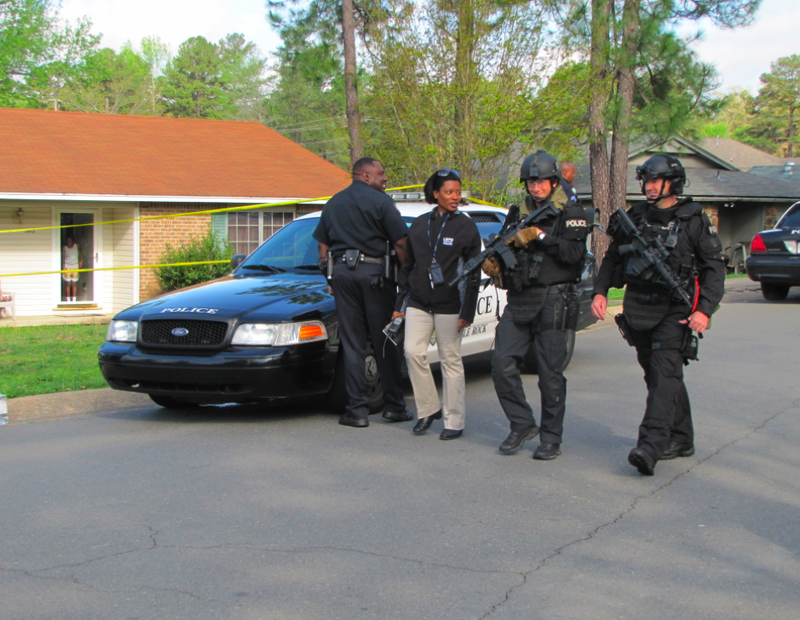 SWAT officers arrive at a house on St. James Court Thursday morning.