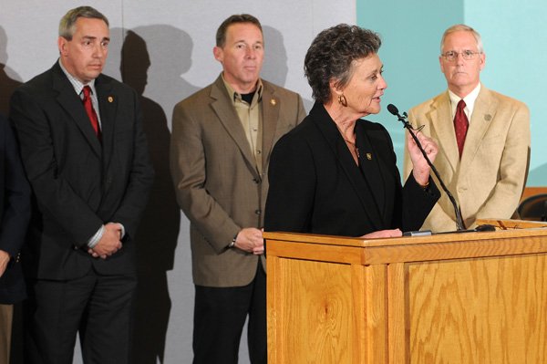 Springdale Police Chief Kathy O’Kelley talks during a news conference Wednesday at the Springdale city council chambers. Officials announced some of the results of a multi-agency drug investigation in Northwest Arkansas. The investigation resulted in charges against and arrests of numerous defendants. Other officials in attendance included, from left, Fayetteville Police Chief Greg Tabor, Washington County Sheriff Tim Helder and Rogers Police Chief James Allen.