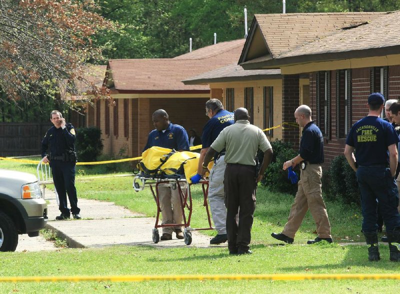 Arkansas Democrat-Gazette/STATON BREIDENTHAL --3/22/12 -- Pulaski County Coroner's Office personell remove a body Thursday morning after a mother and her four children were found dead in a duplex at 3A South Simmons Drive in Jacksonville.