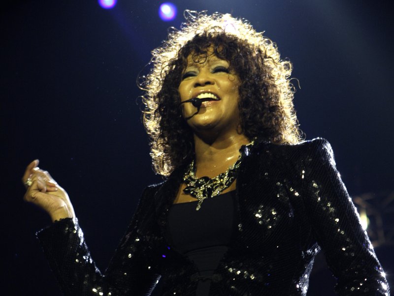 In this April 25, 2010 file photo, singer Whitney Houston performs at the o2 in London as part of her European tour. Coroner's officials said Thursday, March 22, 2012, that Houston drowned, but her death was also caused by heart disease and cocaine use that suggested she was chronically using the drug. Houston died Feb. 11, in California at the age of 48. 