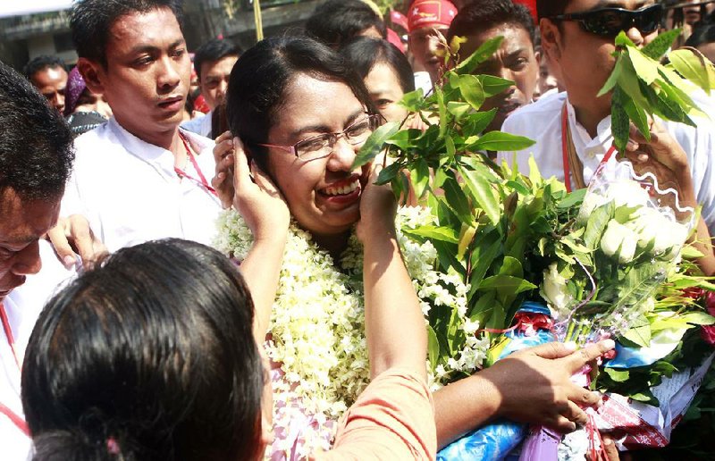 Supporters greet Phyu Phyu Thin, an HIV activist and a candidate in Aung San Suu Kyi’s National League for Democracy party, at a rally Friday in Rangoon. 