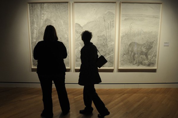 Museumgoers look at Michael Waugh’s “Decline and Fall (Selected Readings from Volumes 1, 2 and 3)” in Crystal Bridges Museum of American Art’s Wonder World on Friday. 