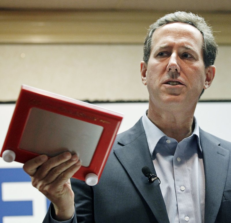 Republican presidential candidate former Pennsylvania Sen. Rick Santorum waves an Etch-A-Sketch while criticizing the policies of GOP presidential candidate Mitt Romney at a rally in Shreveport, La., Friday, March 23, 2012. Santorum has strong support among many conservative voters in the state, which his campaign hopes results in winning Louisiana's primary on Saturday.