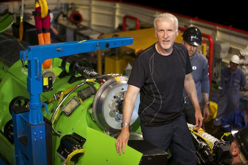 This February 2012 photo, provided by National Geographic, shows explorer and filmmaker James Cameron emerging from the hatch of Deepsea Challenger during testing of the submersible in Jervis Bay, south of Sydney, Australia.