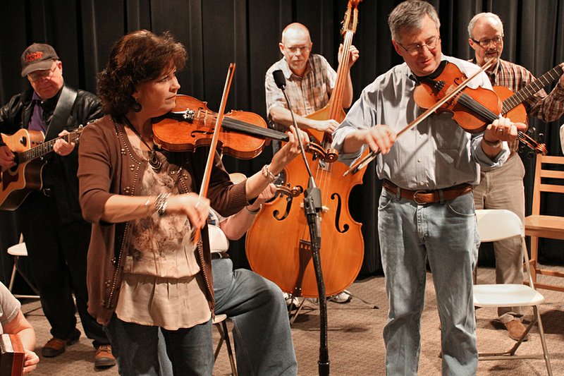 
Rackensack Folklore Society members (from left) Will Taylor, Denise Hammett, Lawrence Gray, Brode Morgan and Lealon Worrell whup it like a mule at the March, 2012, meeting of the Pulaski County chapter at the Arkansas Arts Center.