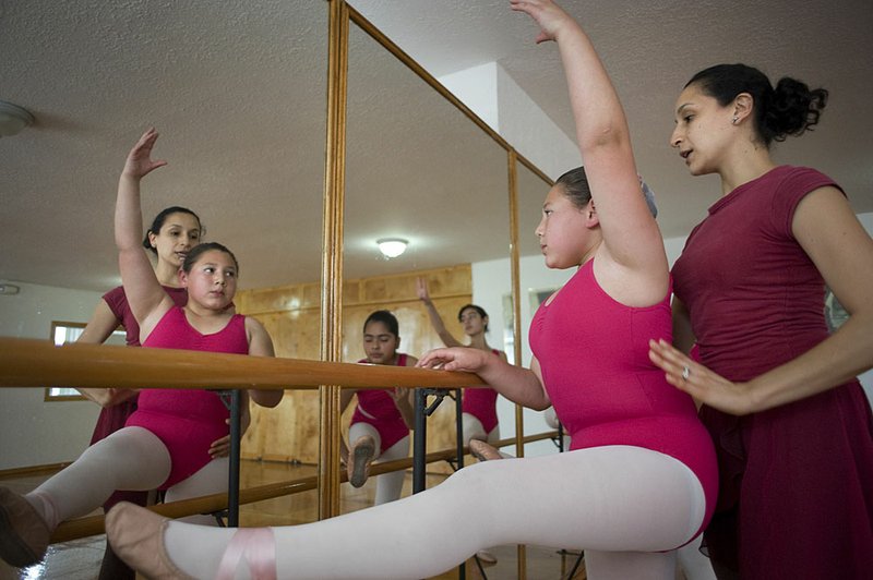 Iliana Jimenez helps Alejandra Rodriguez, 10, in a class at the Academia de Ballet Rosarito in Rosarito Beach, Mexico. Mexico's middle class is spending on luxuries such as dance classes and private schools. Illustrates MEXICO (category i) by William Booth and Nick Miroff (c) 2012, The Washington Post. Moved Sunday March 18, 2012. (MUST CREDIT: Photo by David Maung for The Washington Post).