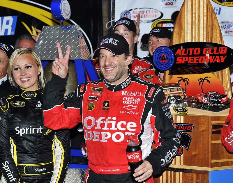 NASCAR driver Tony Stewart won his second Sprint Cup race of the season when rain shortened Sunday’s race by 71 laps. Kyle Busch was second and Dale Earnhardt Jr. was third. 