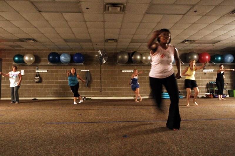 Nia is “a way of life. It’s not just exercise,” says Antoinette Mims, seen leading her Nia exercise class at the Jesse Odom Community Center in Maumelle. “Nia asks you to think about what you’re doing.” 
