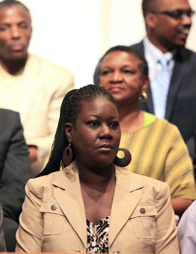 Sybrina Fulton, the mother of teenager Trayvon Martin, listens during a community forum Monday in Eatonville, Fla. 