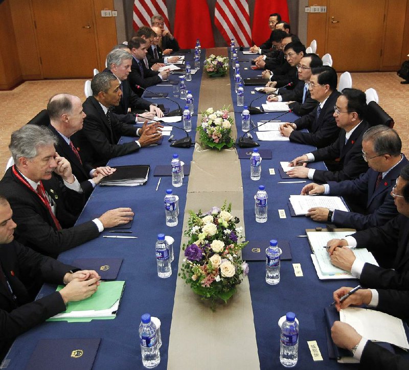 President Barack Obama (fourth from left) meets with Chinese President Hu Jintao (fourth from right) at their bilateral meeting Monday in Seoul, South Korea. 