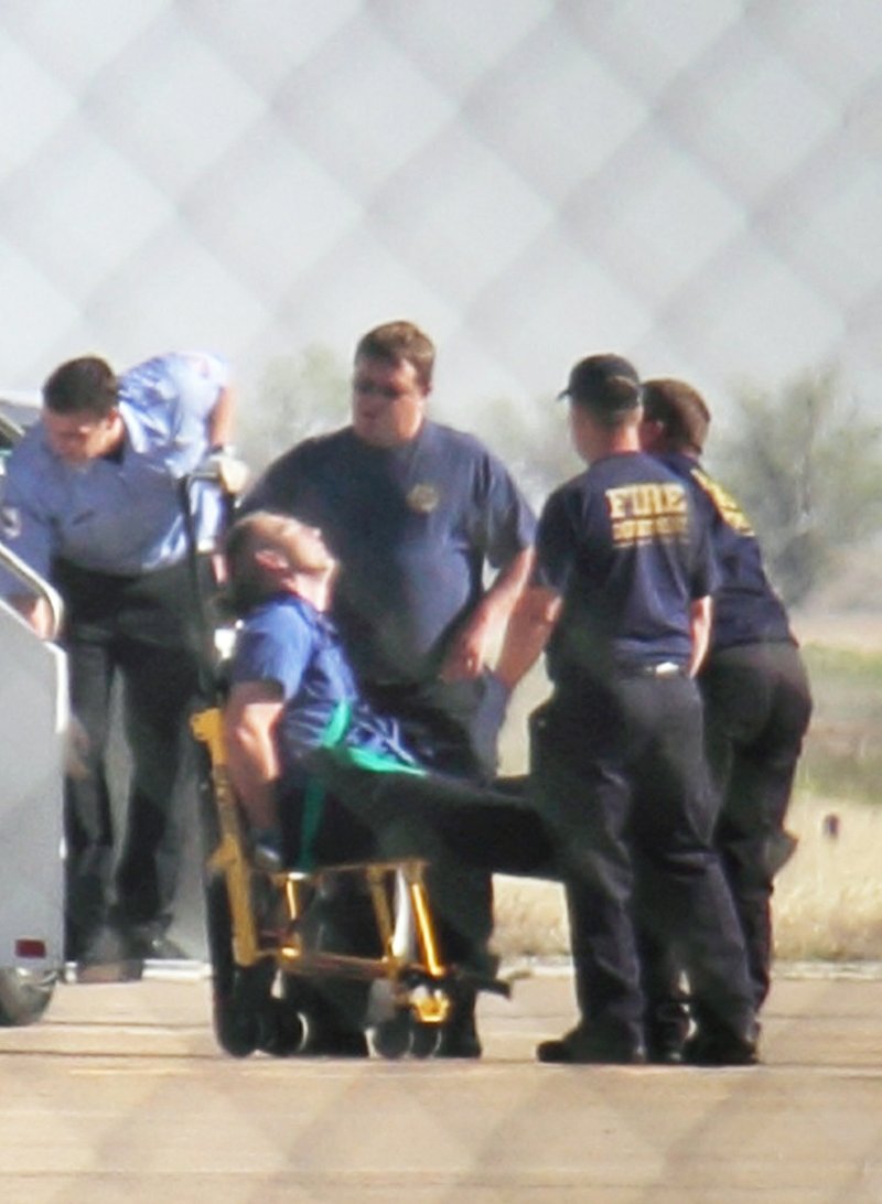 Emergency workers tend to a JetBlue captain who had a "medical situation" during a Las Vegas-bound flight from JFK International airport, Tuesday, March 27, 2012, in Amarillo, Texas. 