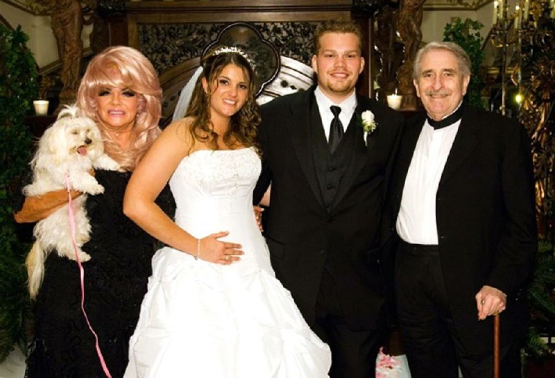 A family dispute has led to lawsuits involving Trinity Broadcasting Network. Brittany Koper (in wedding gown beside husband Michael Koper) is alleging financial improprieties at the network founded by her grandmother Jan Crouch (left) and grandfather Paul Crouch (far right). 