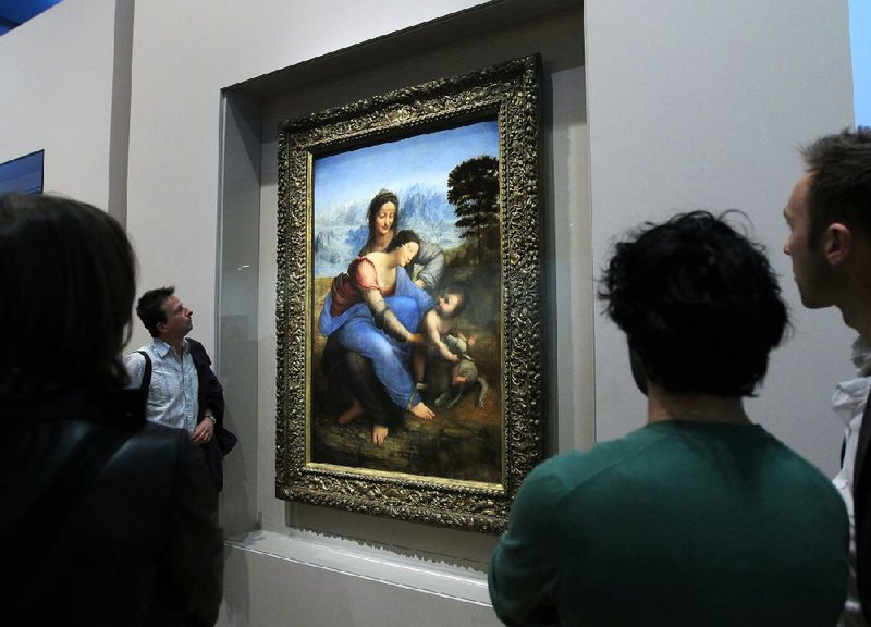Da Vinci’s restored masterpiece The Virgin and Child with Saint Anne, shown Tuesday at the Louvre Museum in Paris, will go on public display today as the anchor of a Da Vinci exhibit. 