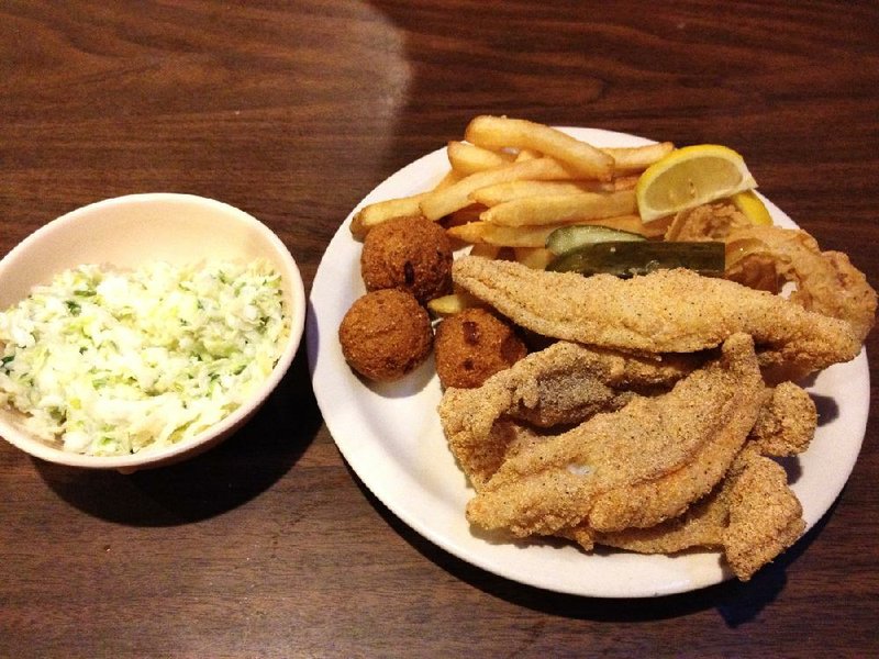 Coleslaw, catfish, fries and hushpuppies at Denton’s Trotline in Benton. 