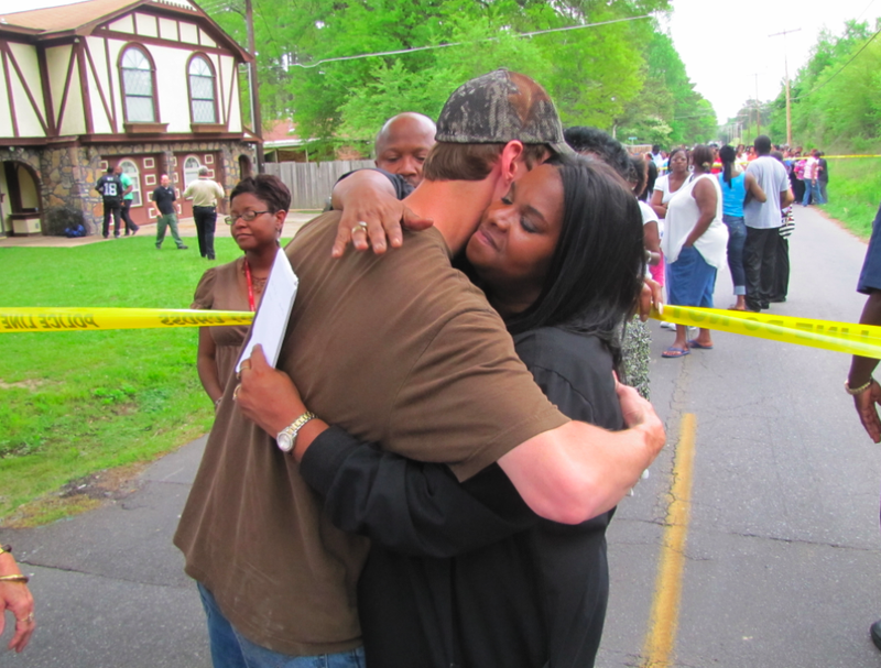 Laurell Hall hugs Caleb McAninch after she spoke with reporters about the 1994 disappearance of her daughter, Cleashindra Hall. McAninch, who goes to church nearby, said he hopes the case is solved soon. "We've been praying for the family for years," he said.
