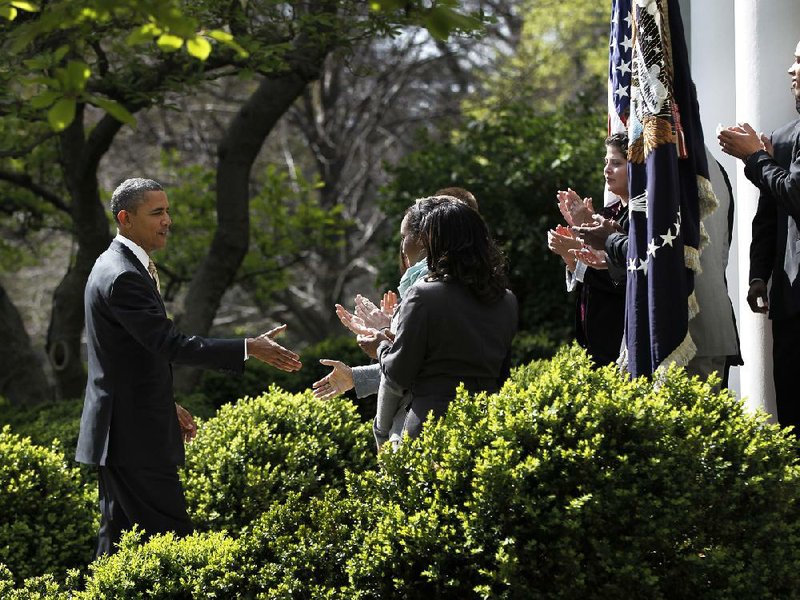 President Barack Obama greets guests in the Rose Garden of the White House in Washington on Thursday after urging Congress to eliminate tax breaks for oil and gas companies. 