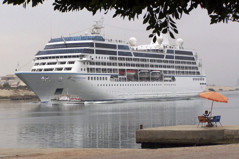 The Maltese registered cruise ship, Azamara Quest, sails through the Suez canal, Egypt, in this April 30, 2010 file photo from the Red sea towards the Mediterranean sea on its way to Athens. The fire on the Azamara Quest started late Friday, March 30, 2012 a day after the ship left Manila for Sandakan, Malaysia, and was immediately put out, said coast guard spokesman Lt. Cmdr. Algier Ricafrente. Five crew members were injured. 