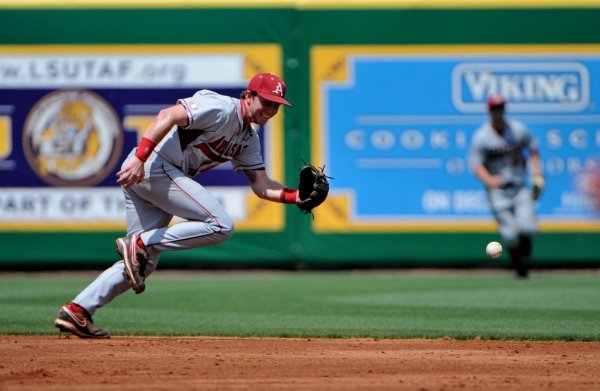 CHRIS DAIGLE/Special to ArkansasOnline -- 4/1/12 -- Arkansas second baseman Bo Bigham charges the ball as Arkansas takes on LSU in Sunday's series finale. LSU swept Arkansas with a 3-2 win in 11 innings.