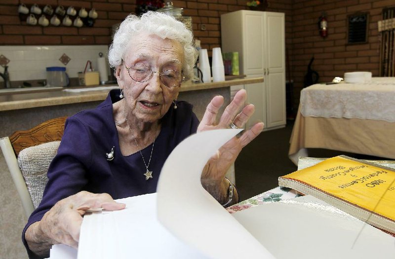 Verla Morris goes through some of her family census data from the 19th and 20th centuries Friday at a residential senior citizen center in Chandler, Ariz. 