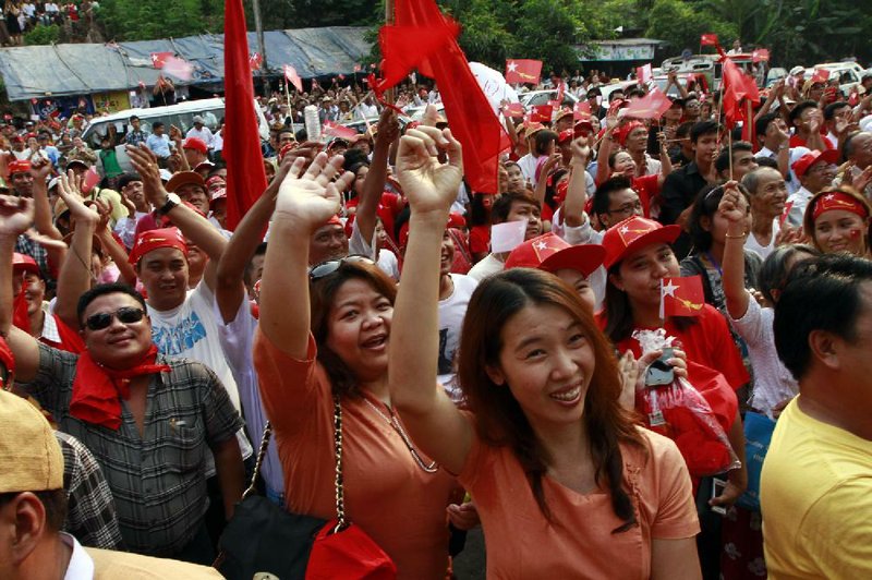 Aung San Suu Kyi’s National League for Democracy party supporters celebrate Sunday in Rangoon, Burma, upon the party’s announcement that the opposition leader had won a parliamentary seat. 