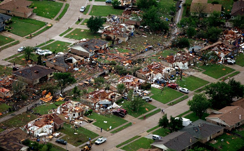 Homes in Lancaster, Texas lay destroyed by a tornado on Tuesday, April 3, 2012. Tornadoes tore through the Dallas area Tuesday, peeling roofs off homes, tossing big-rig trucks into the air and leaving flattened tractor trailers strewn along highways and parking lots.    MAGS OUT