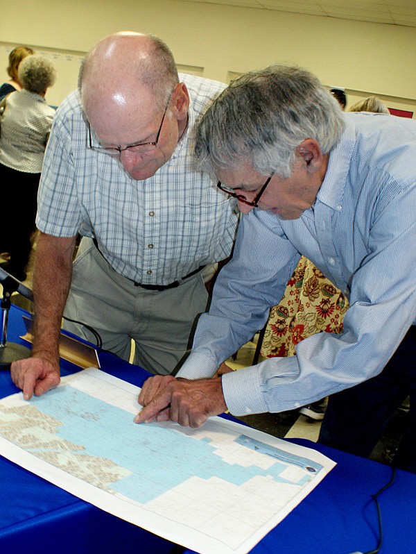 Leon Bertschy, right, points out a property that is included in the area that was voluntarily annexed to be a part of Gravette.