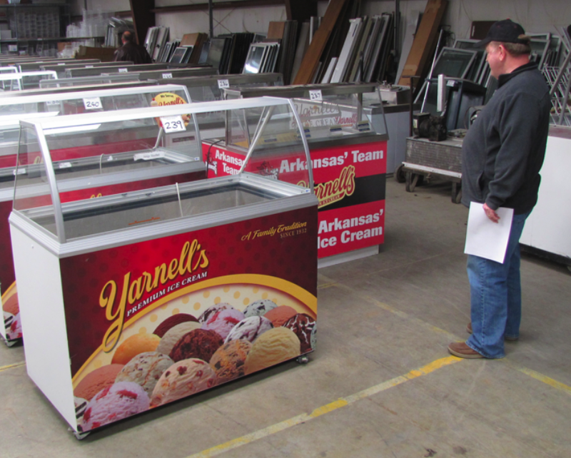 A potential bidder looks over Yarnell's freezers at a bankruptcy auction last year. The auction ultimately culminated with a Chicago company buying all the assets. Yarnell's is expected to be back on store shelves soon.