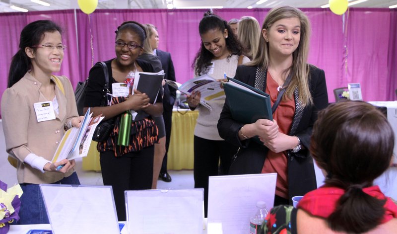 Martina Ryberg, right, of Plymouth State University, talks with Tara Rossetti of On Call International during a job fair for college students on April 4, 2012 in Manchester, N.H. 