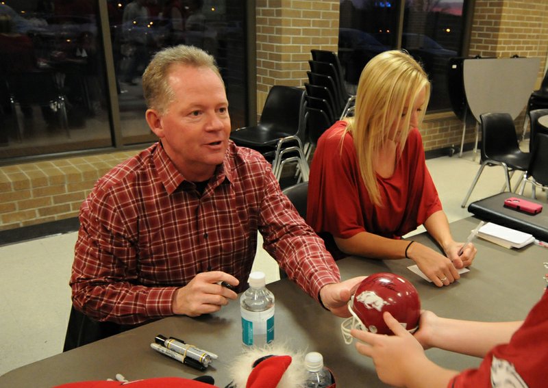 Head football Coach Bobby Petrino and Jessica Dorrell attended a fan event in Searcy on Feb. 23, 2012.