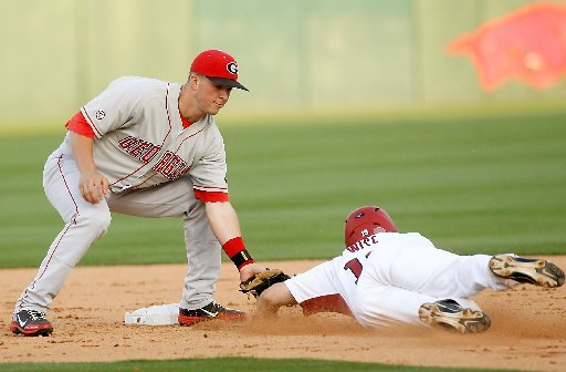Arkansas Democrat-Gazette/JASON IVESTER --04/06/12 -- Arkansas' Jake Wise is tagged out by Georgia shortstop Kyle Farmer at second at Baum Stadium in Fayetteville on Friday, April 6, 2012.