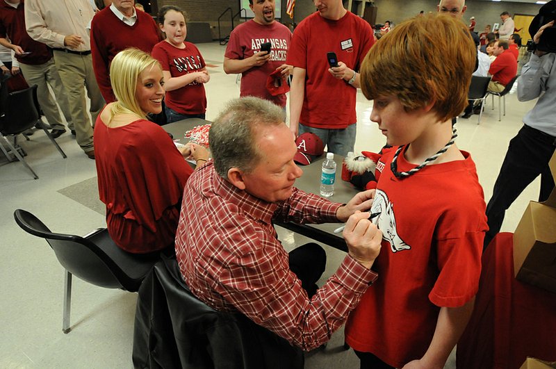 Jessica Dorrell and University of Arkansas Coach Bobby Petrino appear together in this Feb. 23 file photograph at Searcy High School during a meeting of the White County Razorback Club. 