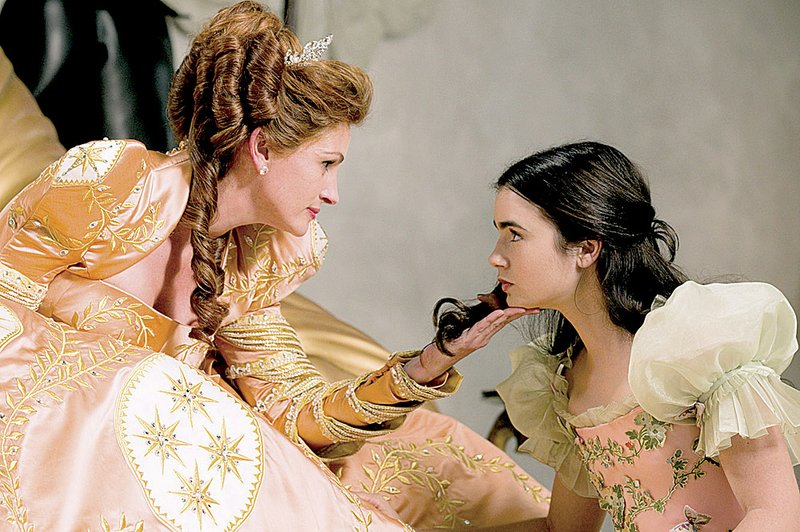 Julia Roberts (left) stars as the evil queen and Lily Collins plays Snow White in Relativity Media’s Mirror Mirror. It came in third at last week’s box office and made more than $18 million. 