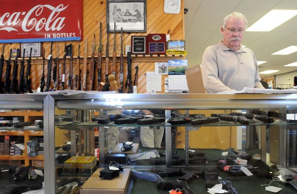 Steve Sturm of Sturm’s Indoor Pistol Range works at his business March 9 in Springdale. Sturm’s was robbed in January of a number of weapons.
