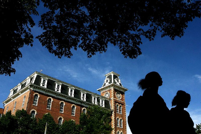 ADVANCE ART FOR WEEKEND STORY

Arkansas Democrat-Gazette/WILLIAM MOORE
Old Main is framed by students and trees Tuesday, March 3, 2012 on the University of Arkansas campus in Fayetteville.