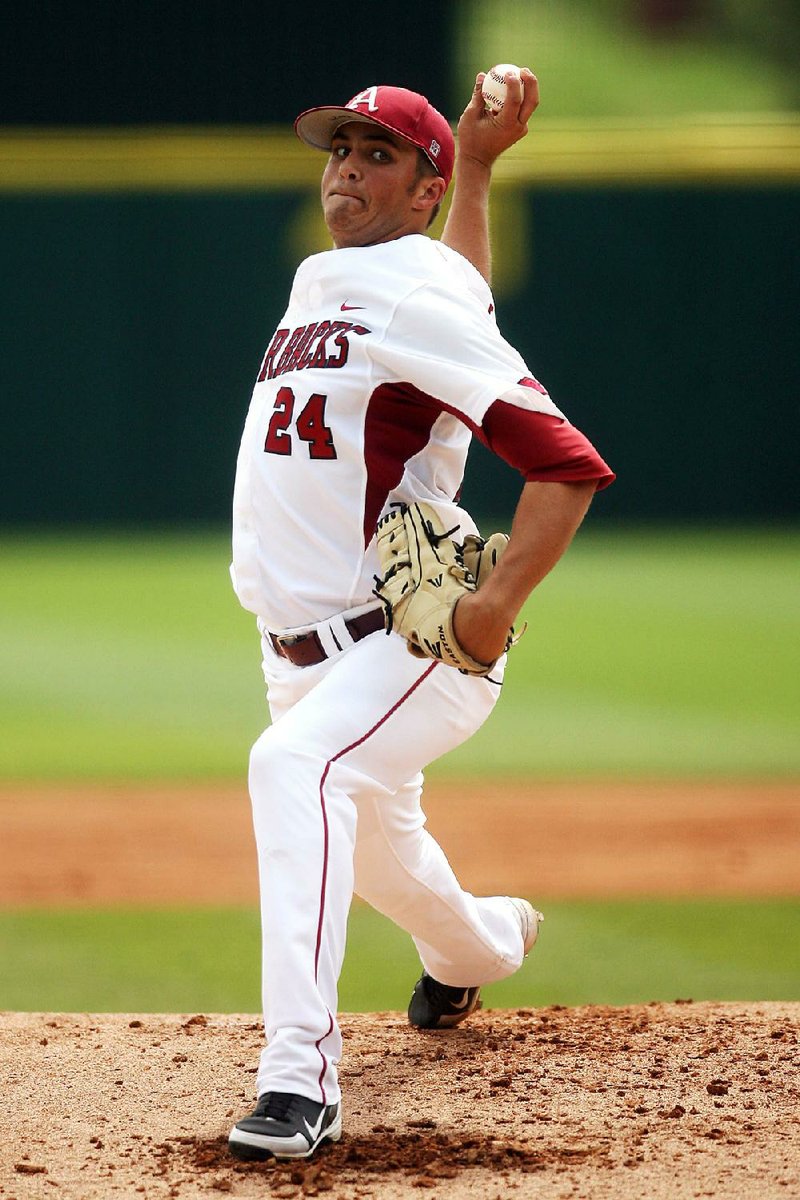 Arkansas Democrat-Gazette/WILLIAM MOORE
Arkansas starting pitcher DJ Baxendale delivers against Georgia Sunday, April 8, 2012 at Baum Stadium in Fayetteville.