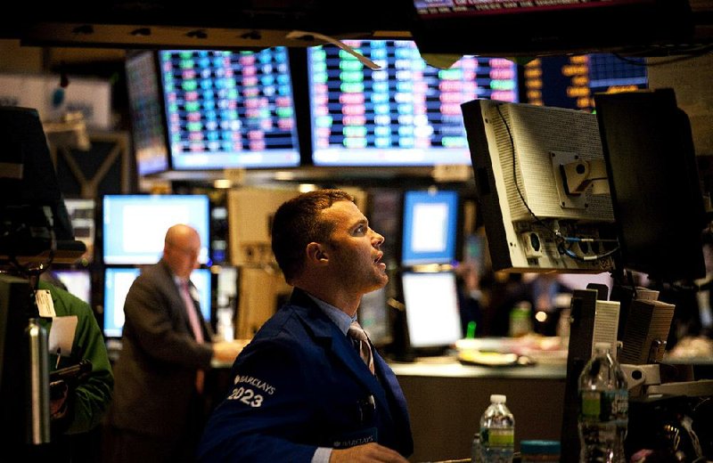 A trader works Tuesday on the floor of the New York Stock Exchange. Stocks fell for a fifth straight day, giving the Standard & Poor’s 500 index its longest losing streak since November. 