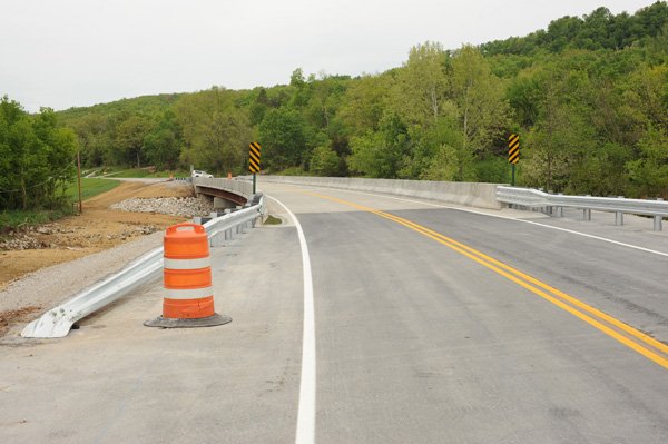 Washington County officials dedicated the new Tilly Willy bridge that spans the West Fork of the White River on Wilson Hollow Road and replaces the former dam that formerly allowed access to Lake Wilson.