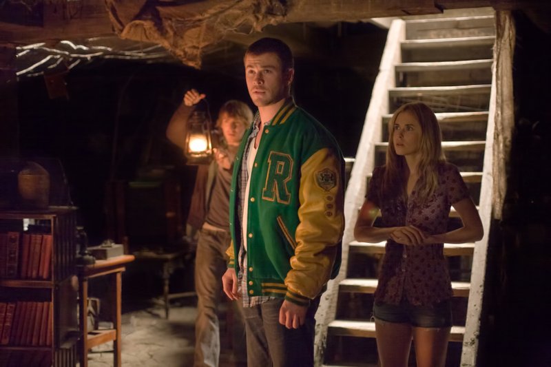 In this film image released by Lionsgate, from left, Fran Kranz, Chris Hemsworth and Anna Hutchison are shown in a scene from "The Cabin in the Woods."