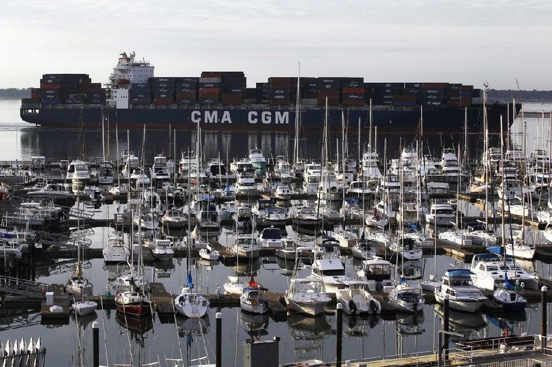 The container ship CMA CGM Georgia sails into Charleston Harbor at Mount Pleasant, S.C., in January. The U.S. trade deficit fell in February to the lowest point in four months. 