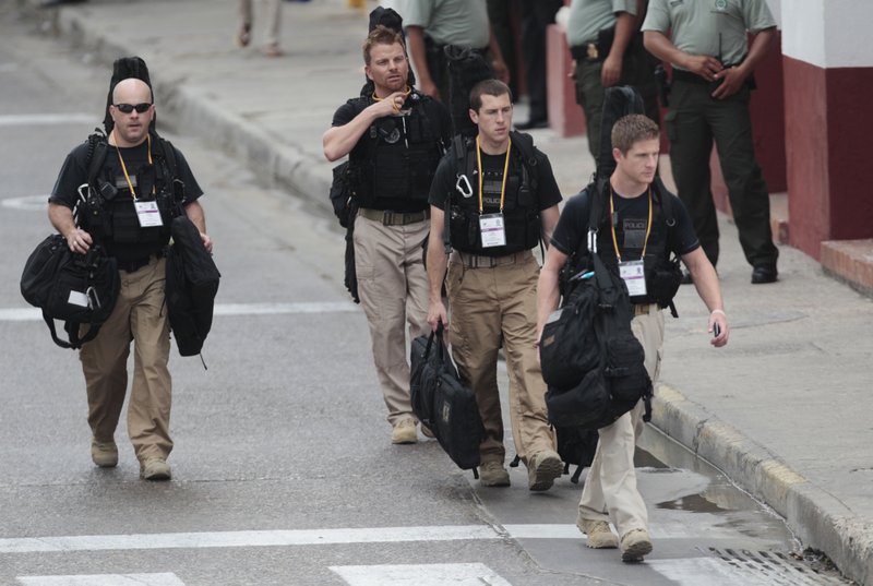 U.S. secret service agents walk around the Convention Center in Cartagena, Colombia, prior to the opening ceremony of the 6th Summit of the Americas at the Convention Center in Cartagena, Colombia, Saturday, April 14, 2012. Last Thursday, a dozen secret service agents sent to provide security for U.S. President Barack Obama, were relieved from duty and replaced with other agency personnel after an incident of alleged misconduct.