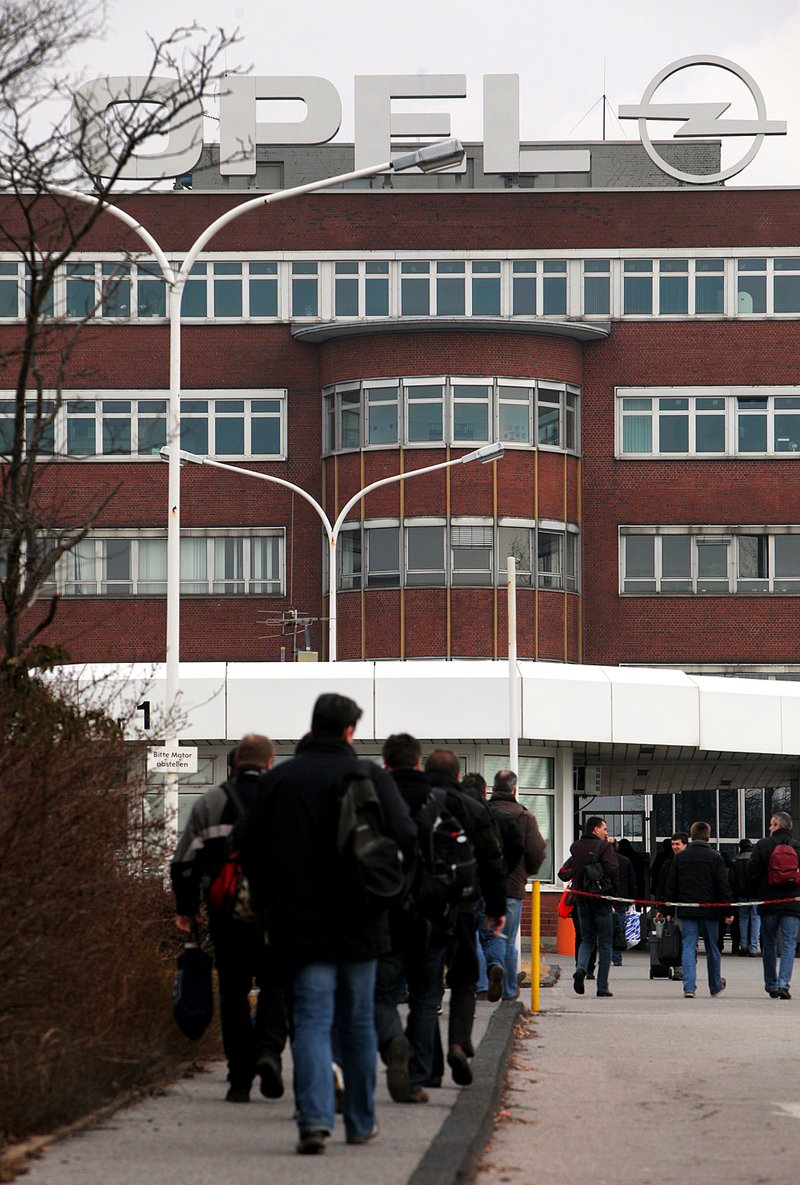 Employees enter the Opel plant in Bochum, Germany, on Feb. 27. The plant’s work force has been greatly reduced. 