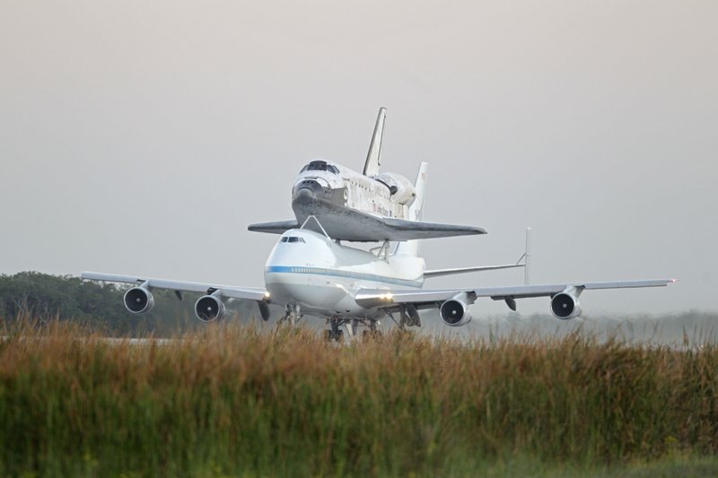 Space shuttle Discovery atop a 747 carrier jet departs the Kennedy Space Center, Tuesday, April 17, 2012, in Cape Canaveral, Fla.