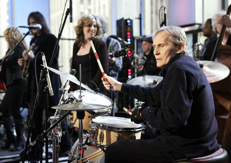 Levon Helm (right) performs with his band on Fox’s Imus in the Morning program in 2009 in New York. 