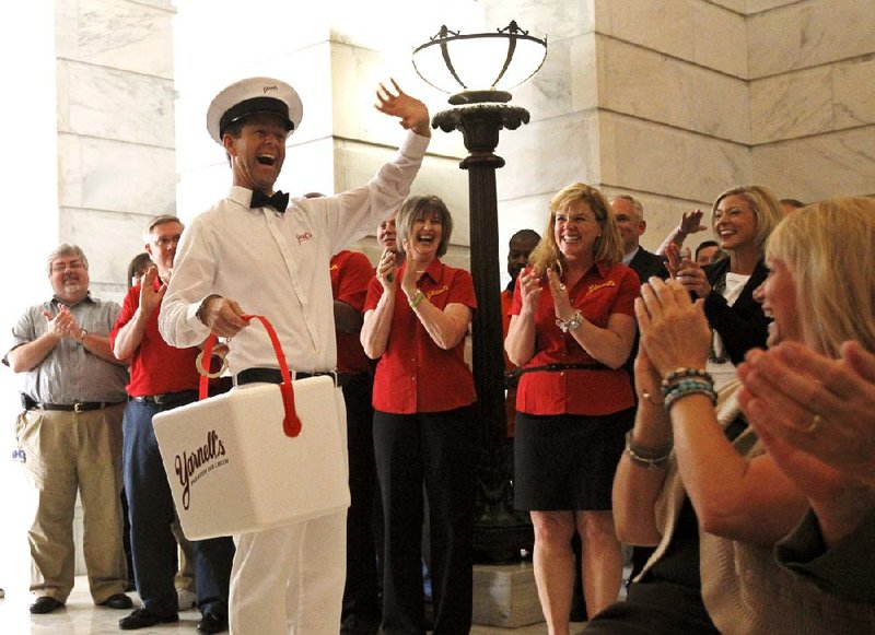 Michael Klucher, dressed as Scoop the Ice Cream Man, delivered Yarnell’s Ice Cream to the Capitol in Little Rock on Thursday. 