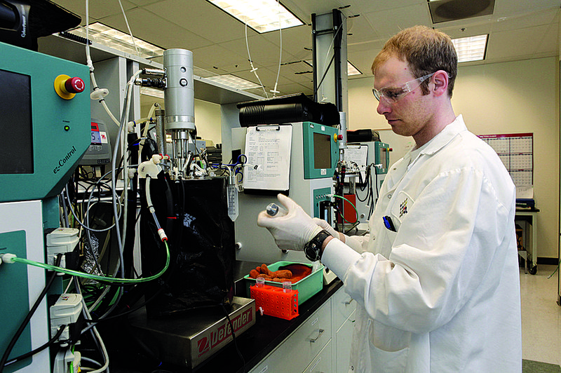 T.J. Yockachonis checks the fermenting process last month at Solazyme in South San Francisco, Calif. 