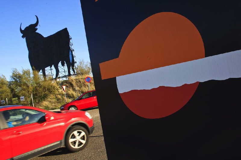 A customer drives Sunday into a Repsol YPF SA gas station near Valermoro, Spain. Repsol had planned to tap oil reserves in Argentina before its Argentine unit YPF was nationalized. 