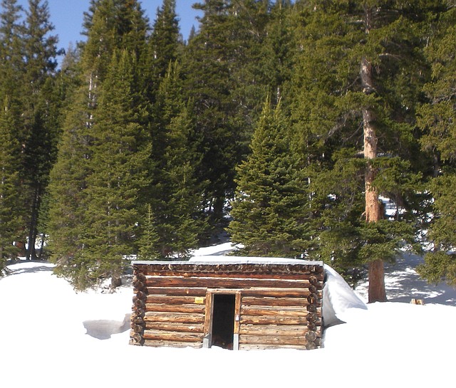 This April 6, 2012, photo, provided by the U. S. Forest Service shows the Conundrum Creek Cabin, in the White River National Forest, near Aspen, Colo., where as many as six cows remain that froze to death. U.S. Forest Service spokesman Steve Segin said Tuesday they need to decide quickly how to get rid of the carcasses. The options: use explosives to break up the cows, burn down the cabin, or using a helicopters or trucks to haul out the carcasses.