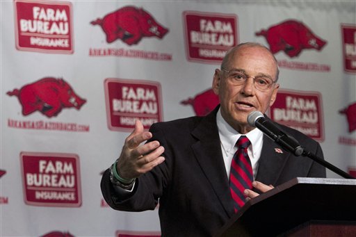 New Arkansas head coach John L. Smith speaks to reporters after being introduced at an NCAA college football news conference in Fayetteville, Ark., Tuesday, April 24, 2012. (AP Photo/Gareth Patterson)