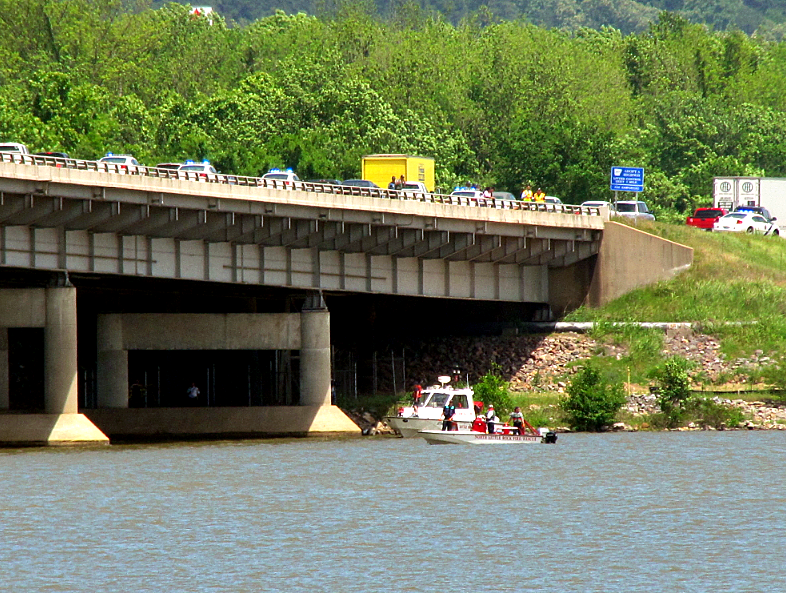 Crews search the Arkansas River after a reported jumping from the I-430 bridge.